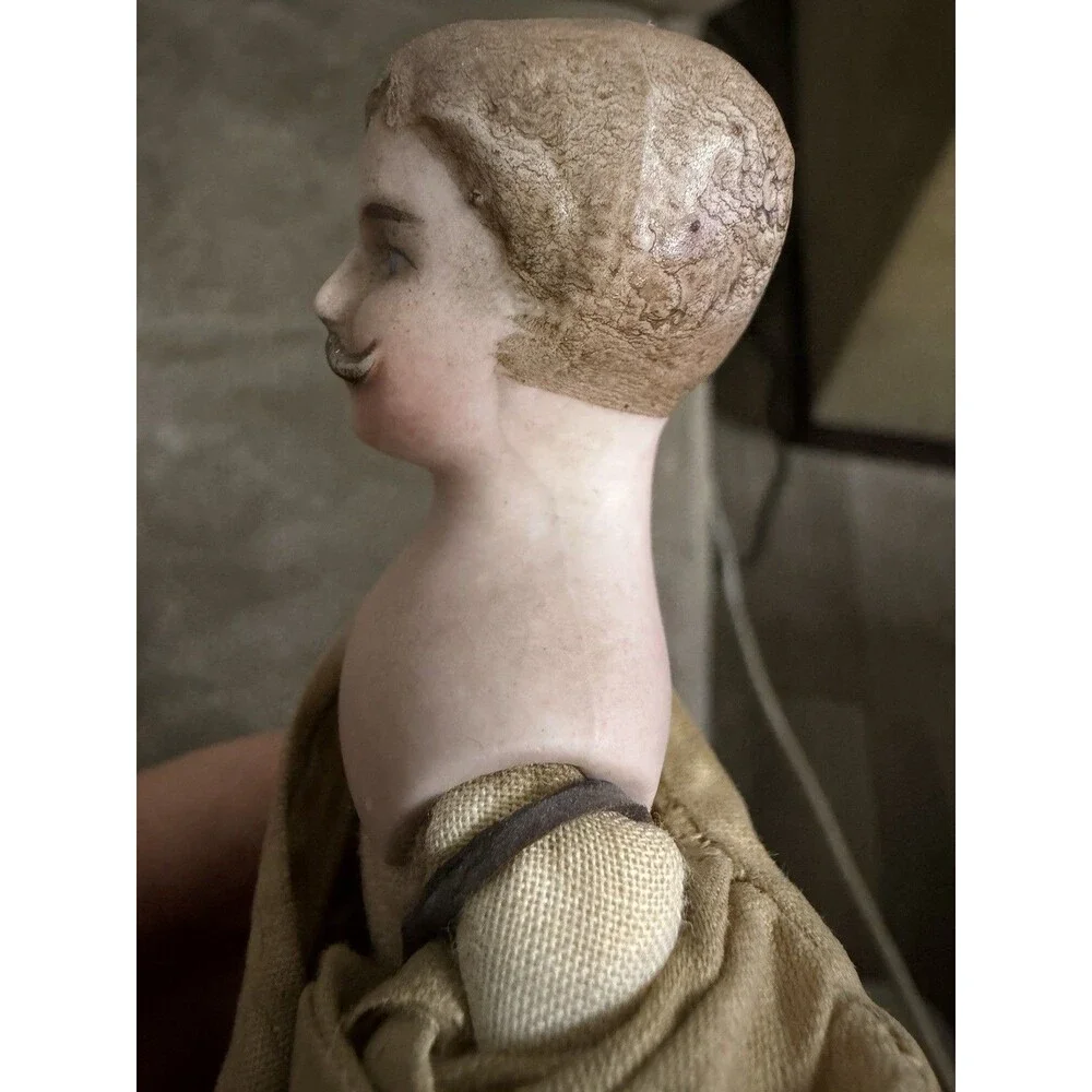Antique German bisque gentleman doll, approximately 7 inches tall,